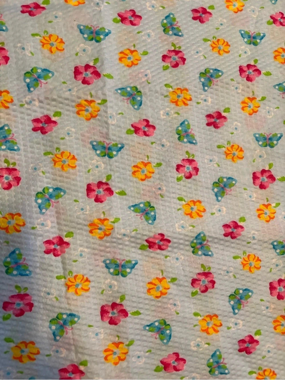 Floral seersucker blue fabric with pink, yellow and green 60” long 44” wide